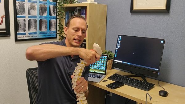 spinal issues from staring down at cell phone